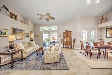 Living room featuring a towering ceiling, french d