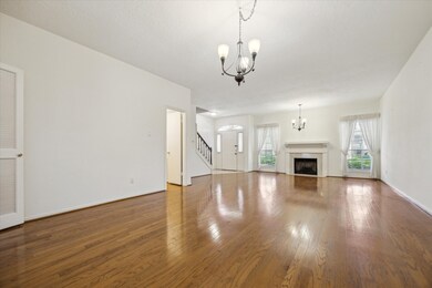 This spacious living room features hardwood floors