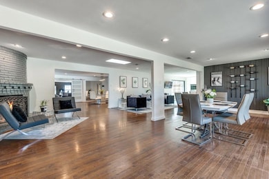 Dining space with hardwood / wood-style floors and