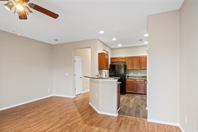 Kitchen featuring black fridge, light wood-type fl