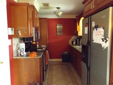 Kitchen with updated/upgraded cabinetry, granite countertops and tile backsplash