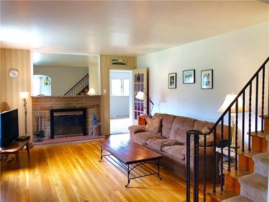 Gleaming hardwoods and a log- burning stone firepl