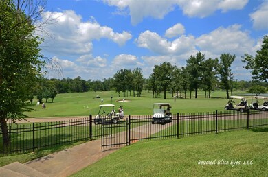 View of home's community with a yard