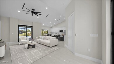 Living area with recessed lighting, ceiling fan, high vaulted ceiling, and light wood-style floors