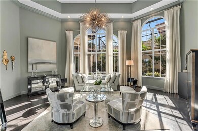 The formal living room has 16-foot ceilings and se