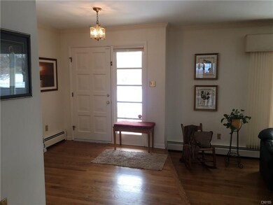 Light and bright foyer at front door.