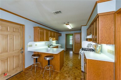 Plenty of cabinets and breakfast bar!