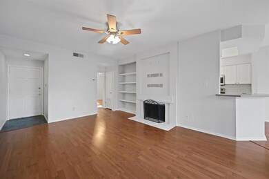 Unfurnished living room featuring baseboards, vis