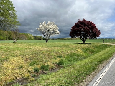 View of home's community featuring a yard and a ru