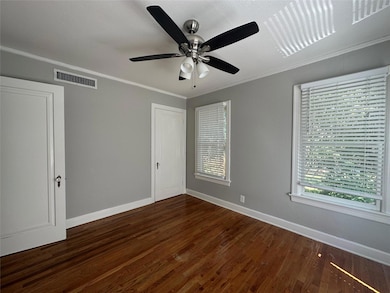 Unfurnished room with baseboards, wood finished fl