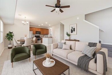 Living area featuring a chandelier, ceiling fan, 