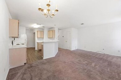 Unfurnished living room with carpet flooring and 