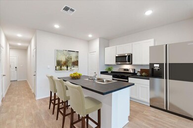Kitchen with appliances with stainless steel fini