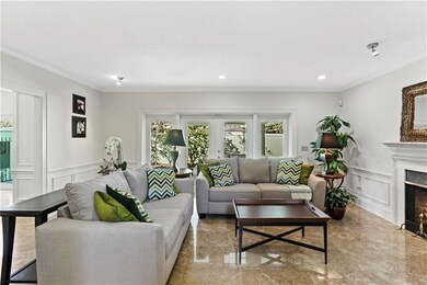 Living Room features French Doors, crown molding a