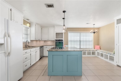 Kitchen featuring appliances with stainless steel