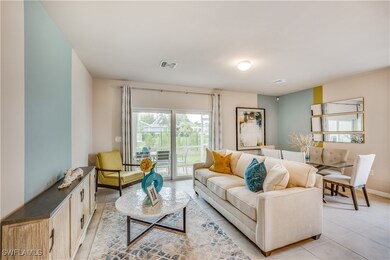 Living room with light tile patterned flooring
