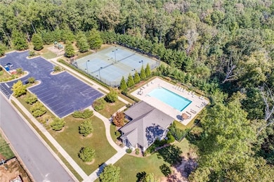 Bird's eye view of a pool and a forest