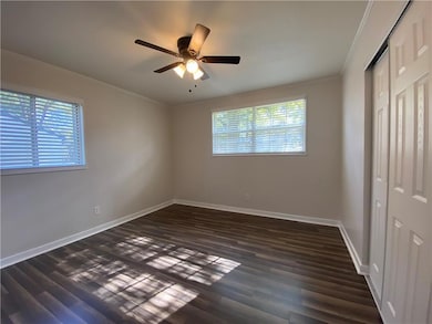 Unfurnished bedroom with multiple windows, ceiling
