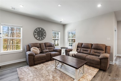 Living room with wood-type flooring