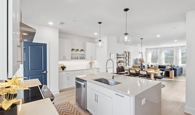 Kitchen with spacious center island and pendant lighting