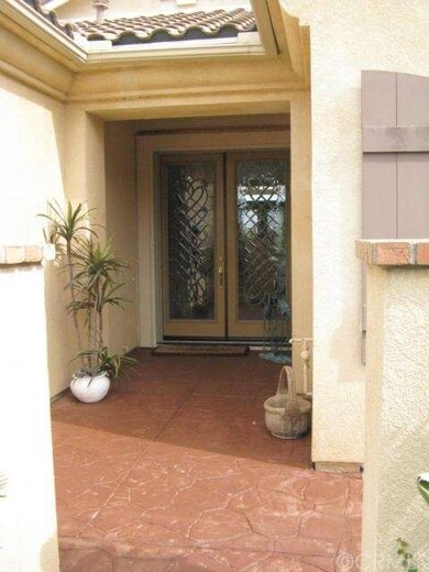 Stamped concrete entry with etched double doors