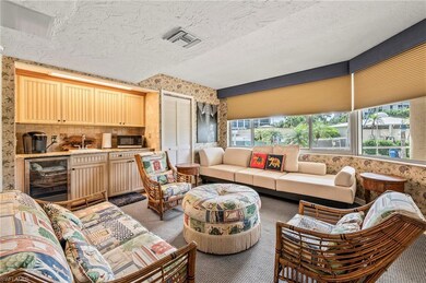 Living room featuring sink, beverage cooler, a tex