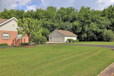 The spacious 1.41 acre lot boasts an extra garage and storage shed, in addition to the attached garage.