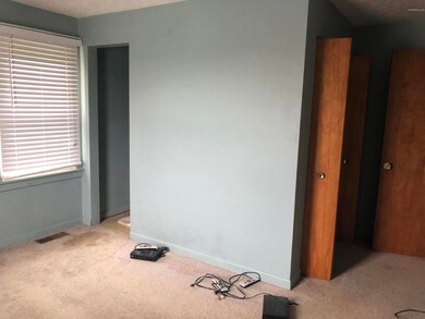 bedroom w/half bath