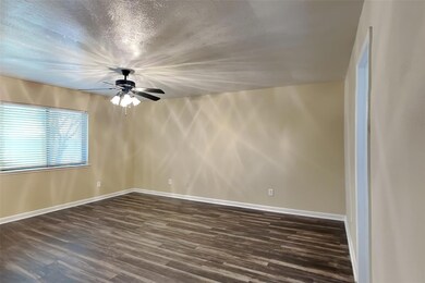 Empty room featuring hardwood / wood-style floorin