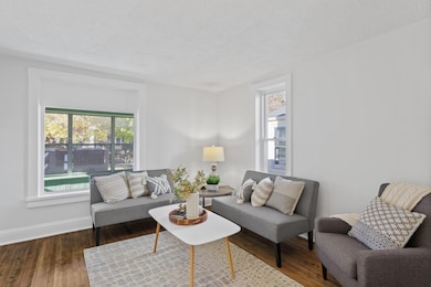 Main level: living room with refinished hardwood floors and all new paint