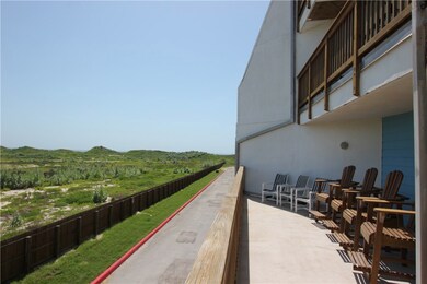 Big balcony with custom chairs, and view of ocean.