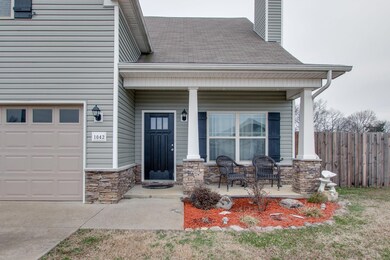 Beautiful landscaping and covered front porch.