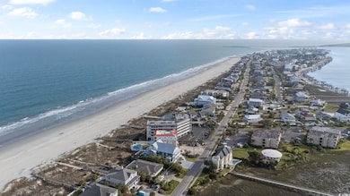 Drone / aerial view featuring a water view and a v