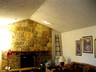 Family Room. Notice the floor to cathedral ceiling
