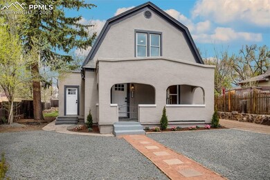Dutch colonial featuring fence, a gambrel roof, an