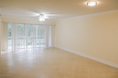 Empty room featuring ceiling fan, light tile patte