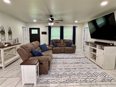 Bright and welcoming living room with tile floorin
