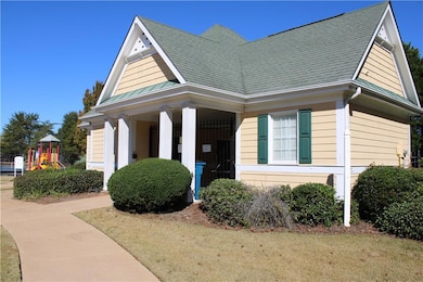 View of front of home with a porch, a playground, a shingled roof, and a front lawn
