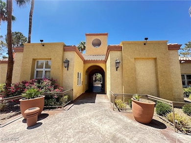 Entrance to property with stucco siding and a tile
