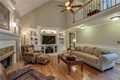 17x17 Greatroom features hardwood floors, vaulted ceiling, tiled front fireplace and furniture quality built in entertainment center.