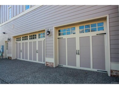 The three car garage has custom craftsman style do