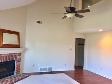 Vaulted ceiling and fan in family room.