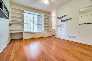 Unfurnished room with light wood-style floors, bas
