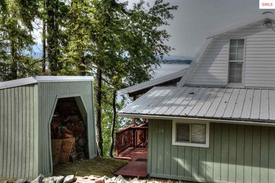 Covered wood shed is just outside entry