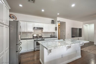 Kitchen with a sink, visible vents, under cabinet