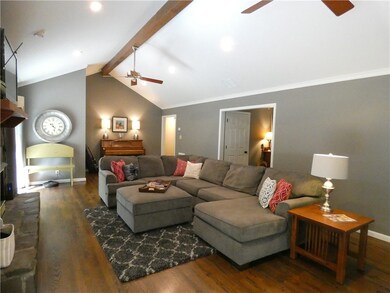 Greatroom with vaulted ceiling, exposed beam, gas-