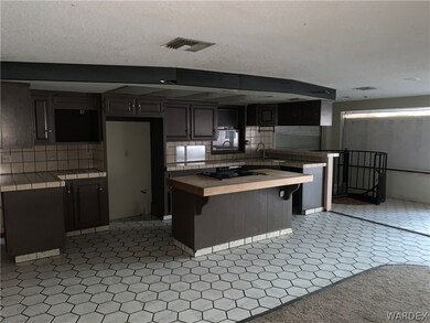 Kitchen featuring dark brown cabinets, sink, light