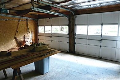 Interior of garage. Note auto door...