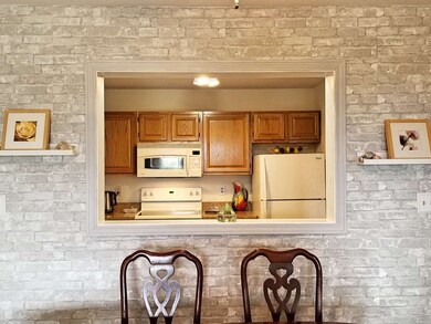 The window from the dining area to the kitchen giv