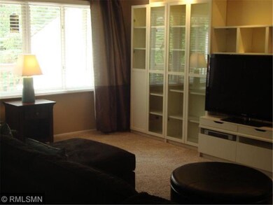 Living room is bright and open with built in cabin